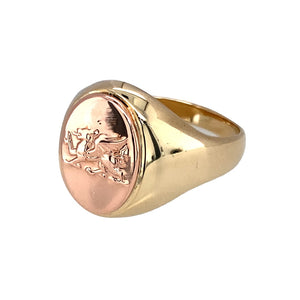 Preowned 9ct Yellow and Rose Gold Clogau Oval Dragon Signet Ring in size W and the weight 12.30 grams. The front of the ring is 17mm high