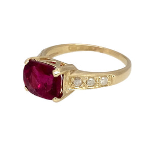 Preowned 9ct Yellow Gold Diamond & Dark Pink Stone Set Ring in size N with the weight 2.80 grams. The pink stone is 7mm by 9mm