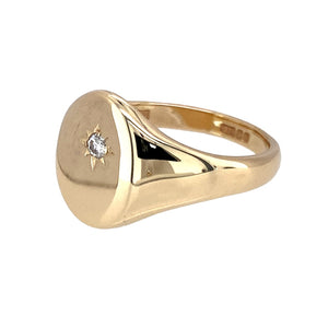Preowned 9ct Yellow Gold & Diamond Set Oval Signet Ring in size U with the weight 6.70 grams. The front of the ring is 14mm high