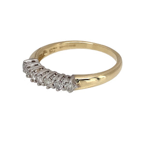 Preowned 9ct Yellow and White Gold & Diamond Set Band Ring in size L with the weight 1.70 grams. There is approximately 25pt of diamond content in total at approximate clarity i1 and colour J - K