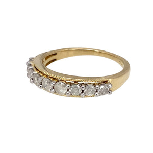 Preowned 9ct Yellow and White Gold & Diamond Set Band Ring in size J with the weight 1.90 grams. There is approximately 27pt of diamond content in total at approximate clarity i3 and colour K - M