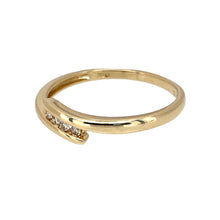 Load image into Gallery viewer, Preowned 9ct Yellow Gold &amp; Diamond Set Crossover Band Ring in size Q with the weight 1.50 grams. The front of the ring is 4mm wide and there is approximately 8pt in total
