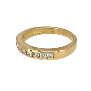 Preowned 18ct Yellow Gold & Diamond Set Band Ring in size M with the weight 4 grams. The front of the band is 3mm wide and there is approximately 24pt of diamond content in total. The diamonds are approximate clarity Si1 and colour H - J