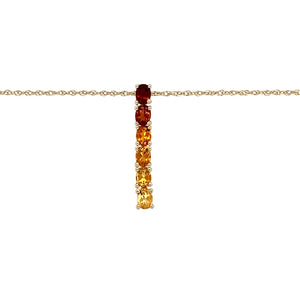 Preowned 9ct Yellow Gold & Graduating Colour Orange/Yellow Stone Set Pendant on an 18" Prince of Wales chain. The gemstones are each 4mm by 3mm and the pendant is 2.5cm long