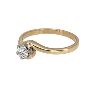 Preowned 9ct Yellow and White Gold & Diamond Set Solitaire Ring in size N to O with the weight 2.10 grams. The brilliant cut diamond is approximately 25pt with approximate clarity VS2 - Si1 and colour I - J