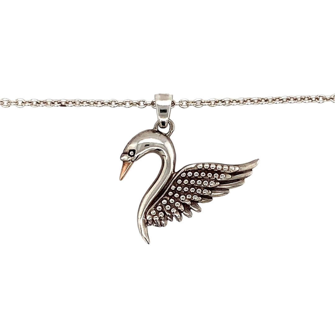 Graceful and symbolic, this pre-owned 925 silver and 9ct gold Clogau swan pendant necklace captures the elegance of nature and the heritage of Welsh design in one timeless piece.

Design: The pendant features a beautifully detailed swan, a symbol of love, loyalty, and purity, measuring 2.5cm long including the bail. Its flowing form is enhanced by 9ct gold accents, bringing warmth and definition to the graceful silhouette.
