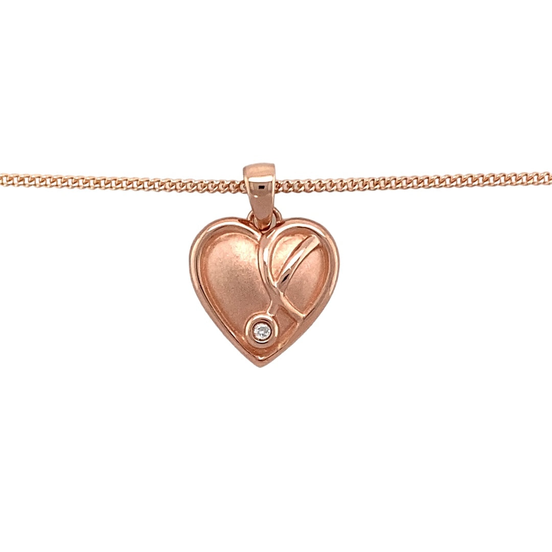 Bring graceful beauty to your collection with this pre-owned 9ct rose gold and diamond set Clogau Vine of Life heart pendant, offering a heartfelt design enriched with sparkling elegance, perfect for special occasions or everyday sophistication.

Design: The romantic heart shape is delicately entwined with the Vine of Life motif, symbolising connection, growth, and enduring love.
Material: Crafted from 9-carat rose gold, the warm, blush-toned finish enhances the intricate vine detailing