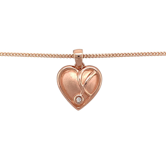 Bring graceful beauty to your collection with this pre-owned 9ct rose gold and diamond set Clogau Vine of Life heart pendant, offering a heartfelt design enriched with sparkling elegance, perfect for special occasions or everyday sophistication.

Design: The romantic heart shape is delicately entwined with the Vine of Life motif, symbolising connection, growth, and enduring love.
Material: Crafted from 9-carat rose gold, the warm, blush-toned finish enhances the intricate vine detailing