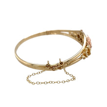 Load image into Gallery viewer, Preowned 9ct Yellow and Rose Gold Clogau Honeycomb and Bee Bangle with the weight 16.20 grams. The front of the bangle is 14mm high and the bangle diameter is 6cm
