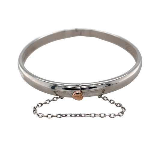 Preowned 925 Silver with 9ct Rose Gold Cariad Heart Hinge Bangle with the weight 19.40 grams. The bangle width is 5mm wide and the bangle diameter is 6cm
