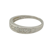 Load image into Gallery viewer, Add a touch of timeless elegance to your jewellery collection with this pre-owned 9ct white gold &amp; diamond set band ring, featuring:

Design: A classic band-style ring, perfect for everyday wear or special occasions.
Material: 9-carat white gold, offering a sleek and polished finish.
Gemstone Detail: Set with approximately 0.25ct total diamond content, adding brilliance and sophistication.
Ring Width: The front of the band measures 4mm wide, creating a refined yet noticeable look.

