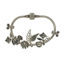 Load image into Gallery viewer, Add a sentimental and stylish piece to your jewellery collection with this pre-owned 925 silver 7&quot; charm bracelet, featuring:

Design: A meaningful charm bracelet, adorned with a variety of symbolic charms.
Material: 925 sterling silver, offering a high-quality and polished finish.
Bracelet Length: Measures 7 inches, providing a comfortable and secure fit.
Charms Included: Features heartfelt charms engraved with &quot;Family,&quot; &quot;Mum,&quot; and &quot;Care,&quot; alongside a dog, angel wing, and more
