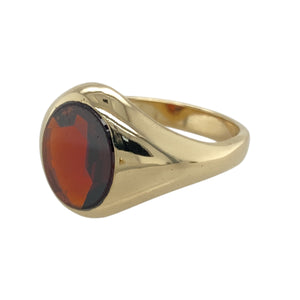 Add rich colour to your jewellery collection with this pre-owned 9ct yellow gold and red stone oval signet ring, featuring:

Design: A bold oval signet style showcasing a deep red garnet-coloured stone, perfect for a refined, vintage-inspired look.
Material: 9-carat yellow gold, offering a warm, polished finish that enhances the richness of the stone.
Gemstone Detail: Set with a 12mm by 10mm oval red stone, adding depth and character to the design.
