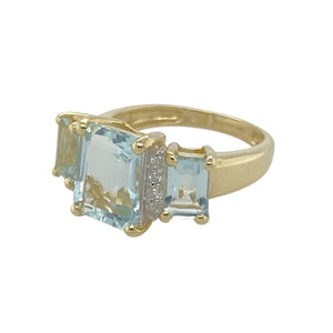 Add a touch of elegance to your jewellery collection with this pre-owned 9ct yellow gold diamond and aquamarine set ring.

Design: Featuring a striking design, this ring showcases a beautiful center aquamarine stone flanked by two smaller aquamarine stones, with diamonds adding a touch of sparkle to the overall design.
Material: Made from 9-carat yellow gold, offering a warm and polished finish that complements the cool blue tones of the aquamarine.
Gemstone Detail: The center aquamarine measures 9mm by 7mm