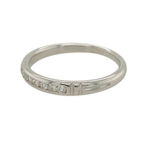 Load image into Gallery viewer, Add a touch of sophistication to your jewellery collection with this pre-owned 14ct white gold diamond set band ring.

Design: A sleek and elegant band featuring a subtle yet sparkling diamond set detail, perfect for timeless style.
Material: Made from 14-carat white gold, offering a polished and refined finish that enhances the brilliance of the diamonds.
Gemstone Detail: Set with dazzling diamonds that add a touch of sparkle to the classic band design.

