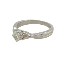 Load image into Gallery viewer, Add a touch of elegance to your jewellery collection with this pre-owned 9ct white gold diamond set solitaire ring.

Design: A classic solitaire design with a stunning center diamond, enhanced by a unique twist detail on the shoulders, creating a modern yet timeless look.
Material: Made from 9-carat white gold, offering a sleek and polished finish that complements the brilliance of the diamond.
Gemstone Detail: The center diamond is approximately 0.25ct, providing a delicate and captivating sparkle.

