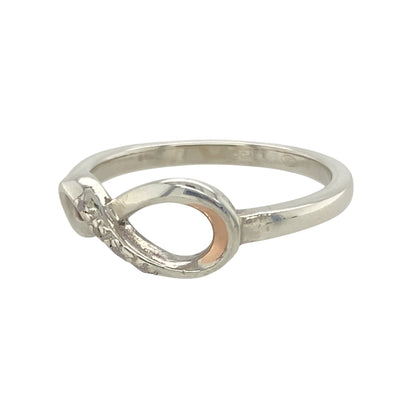 Add a touch of elegance and meaning to your jewellery collection with this pre-owned 925 silver with 9ct rose gold and diamond set infinity Clogau ring.

Design: Featuring the iconic infinity symbol, this ring represents eternity and unending love, enhanced by delicate 9ct rose gold and diamond detailing.
Material: Made from 925 sterling silver, with 9ct rose gold accents and a diamond setting that adds a touch of luxury.
Size & Weight: Weighing 2.30 grams, this ring is available in size O