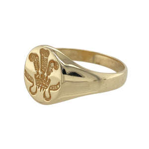 Add a touch of heritage to your jewellery collection with this pre-owned 9ct yellow gold Welsh Three Feathers signet ring.

Design: A bold signet ring featuring the iconic Welsh Three Feathers emblem, symbolising strength and heritage.
Material: Made from 9-carat yellow gold, offering a warm, polished finish that highlights the detailed design.
Size & Weight: Weighing 5.10 grams, this ring is size X, with the front of the ring measuring 13mm high for a striking presence.