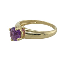 Load image into Gallery viewer, Add a touch of colour to your jewellery collection with this pre-owned 9ct yellow gold and amethyst set solitaire ring.

Design: A classic solitaire ring featuring a stunning round amethyst stone, set in a simple yet elegant 9ct yellow gold band.
Material: Made from 9-carat yellow gold, offering a warm, polished finish that enhances the deep purple hue of the amethyst.
Gemstone Detail: The amethyst stone has a 7mm diameter, providing a bold and vibrant pop of colour.

