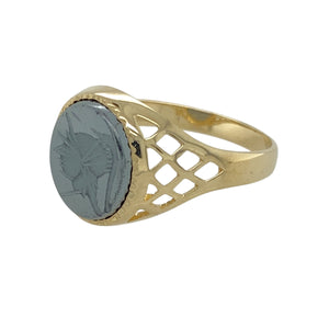 Add a bold and distinctive piece to your jewellery collection with this pre-owned 9ct yellow gold and hematite Centurion set oval signet ring.

Design: A striking signet ring featuring a detailed hematite Centurion carving, set within an elegant open basket-style shoulder design for a unique and timeless look.
Material: Made from 9-carat yellow gold, offering a warm, polished finish that enhances the depth and character of the hematite stone.
Gemstone Detail: The hematite stone measures 12mm by 10mm