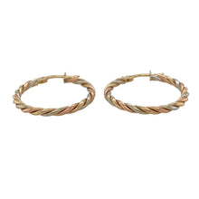 Load image into Gallery viewer, Add a vibrant and dynamic touch to your jewellery collection with these pre-owned 9ct yellow, white, and rose gold twisted hoop creole earrings.

Design: A striking twisted hoop design, expertly combining yellow, white, and rose gold for a multi-tone effect that creates a bold, contemporary look.
Material: Made from 9-carat yellow, white, and rose gold, offering a polished finish that highlights the twisted design and the harmonious blend of colours.

