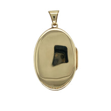 Load image into Gallery viewer, This pre-owned 9ct yellow and white gold floral patterned oval locket is an elegant and sentimental piece.

Design: Showcases a delicate floral pattern on the front, enhanced by white gold detailing for added contrast and beauty.
Material: 9ct yellow and white gold, combining classic warmth with a subtle two-tone effect.
Size &amp; Weight: Weighs 4.40 grams, offering a comfortable yet substantial feel.

A timeless locket, perfect for holding cherished memories close to the heart.
