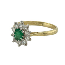 Load image into Gallery viewer, Add vintage-inspired elegance to your jewellery collection with this pre-owned 18ct yellow gold diamond and emerald set cluster ring, featuring:

Design: A classic cluster setting with a vibrant emerald centre surrounded by sparkling diamonds for a timeless, eye-catching look.
Material: 18-carat yellow gold, offering a rich and luxurious polished finish.
Gemstone Detail: Features a 5mm by 4mm emerald at the centre, with approximately 0.25ct of diamond content set around it.

