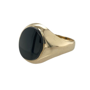 Add bold contrast to your jewellery collection with this pre-owned 9ct yellow gold and onyx set oval signet ring, featuring:

Design: A classic oval signet style with a striking black onyx centre, offering timeless appeal with a refined edge.
Material: 9-carat yellow gold, providing a warm and polished finish that complements the deep tone of the stone.
Gemstone Detail: Set with an approximately 11mm by 9mm oval onyx stone, creating a strong and stylish focal point.

