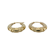 Load image into Gallery viewer, Add classic detail to your jewellery collection with these pre-owned 9ct yellow gold patterned oval hoop creole earrings, featuring:

Design: An elegant oval hoop creole style with intricate patterning for added texture and timeless appeal.
Material: 9-carat yellow gold, offering a rich, polished finish that highlights the detailed design.
Weight: Total weight of 2.40 grams, providing a comfortable fit with a noticeable presence.
