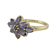 Load image into Gallery viewer, Add a touch of colour and charm to your jewellery collection with this pre-owned 9ct yellow gold flower cluster ring, featuring:

Design: A floral cluster arrangement with petal-like tanzanite-coloured stones, creating a vibrant and feminine silhouette.
Material: 9-carat yellow gold, offering a warm and polished finish that complements the cool tones of the stones.
Gemstone Detail: Set with rich tanzanite-coloured stones that form a striking flower design—perfect for adding a pop of colour.

