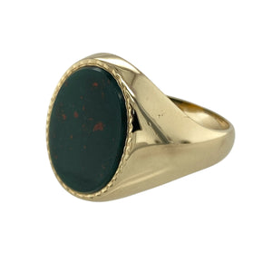 Add a bold and distinguished piece to your jewellery collection with this pre-owned 9ct yellow gold signet ring, featuring:

Design: A classic oval signet style that exudes timeless sophistication, perfect for everyday wear or special occasions.
Material: 9-carat yellow gold, offering a rich and enduring finish.
Gemstone Detail: Set with a deep green bloodstone measuring 16mm by 12mm, known for its subtle red flecks and strong presence.
