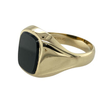 Load image into Gallery viewer, Make a bold and timeless statement with this pre-owned 9ct yellow gold signet ring, featuring:

Design: A classic rectangular signet style with clean lines and strong presence—perfect for those who appreciate traditional elegance.
Material: 9-carat yellow gold, offering a rich and polished finish that complements the dark stone beautifully.
Gemstone Detail: Set with a striking 12mm by 10mm black onyx, creating a bold contrast and refined focal point.

