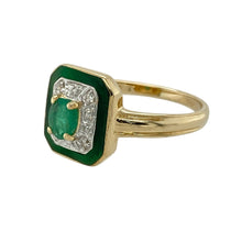 Load image into Gallery viewer, Add vintage-inspired elegance to your jewellery collection with this pre-owned 14ct yellow and white gold diamond and emerald set halo ring, featuring:

Design: A beautifully detailed halo design with layered accents, combining precious stones and enamel for a unique, eye-catching effect.
Material: 14-carat yellow and white gold, offering a luxurious blend of warm and cool tones.
Gemstone Detail: Features a 5mm by 3mm oval-cut emerald at the centre, surrounded by a halo of sparkling diamonds
