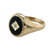 Load image into Gallery viewer, Add bold elegance to your jewellery collection with this pre-owned 9ct yellow gold diamond and onyx set oval signet ring, featuring:

Design: A classic oval signet style with a sleek onyx centre, finished with a small diamond set in white gold for a refined contrast.
Material: 9-carat yellow gold with white gold detailing, offering a rich and polished two-tone look.
Gemstone Detail: Set with an 11mm by 9mm oval onyx, deep in colour and smooth in finish
