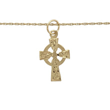 Load image into Gallery viewer, Celebrate tradition and spirituality with this pre-owned 9ct yellow gold Celtic cross necklace, featuring:

Design: A detailed Celtic cross pendant with traditional knotwork, symbolising eternal life, faith, and heritage.
Material: 9-carat yellow gold, offering a rich, polished finish that complements the intricate design.
Pendant Detail: Measures approximately 2.4cm long including the bail—subtle yet meaningful in its presence.
Chain: Comes on an 18-inch Prince of Wales chain
