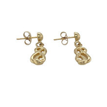 Load image into Gallery viewer, Add a touch of Celtic elegance to your collection with these pre-owned 9ct yellow gold swirl style drop earrings, featuring:

Design: A graceful Celtic-inspired swirl design, rich in symbolism and movement, echoing themes of eternity and natural flow.
Material: 9-carat yellow gold, offering a warm, polished finish that highlights the intricate curves of the design.
Style: Lightweight drop earrings that combine heritage charm with timeless sophistication.

