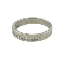 Load image into Gallery viewer, Add understated sparkle to your collection with this pre-owned 9ct white gold diamond set band ring, featuring:

Design: A sleek and modern band style set with shimmering diamonds across the front, offering subtle brilliance and timeless appeal.
Material: 9-carat white gold, polished to a bright finish that enhances the sparkle of the stones.
Gemstone Detail: Set with diamonds for a refined touch of luxury—perfect for everyday elegance or special occasions.

