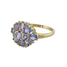 Load image into Gallery viewer, Add a touch of vibrant elegance to your collection with this pre-owned 9ct yellow gold diamond and tanzanite cluster ring, featuring:

Design: A classic cluster style with a striking central tanzanite surrounded by shimmering diamonds, creating a floral-inspired silhouette with timeless appeal.
Material: 9-carat yellow gold, polished to a warm finish that enhances the brilliance and colour of the gemstones.

