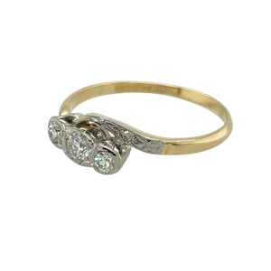 Add a graceful touch of symbolism to your jewellery collection with this pre-owned 18ct yellow gold and platinum diamond set twist trilogy ring, featuring:

Design: A romantic twist on the classic trilogy style, with gracefully curved shoulders that intertwine around three sparkling diamonds—symbolising the past, present, and future.
Material: Beautifully crafted in 18-carat yellow gold, with platinum settings that enhance and secure each diamond with brilliant contrast.
