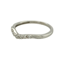 Load image into Gallery viewer, Add subtle elegance to your jewellery collection with this pre-owned 9ct white gold and diamond set wishbone ring, designed to complement with gentle sophistication, featuring:

Design: A delicate wishbone style band, offering a graceful curve that’s perfect for wearing alone or paired with another ring.
Material: Crafted in 9-carat white gold, providing a sleek, modern finish that enhances the sparkle of the diamonds.
Gemstone Detail: Set with shimmering diamonds along the front curve
