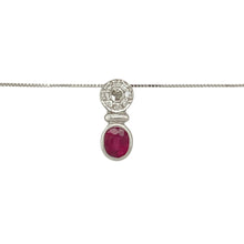 Load image into Gallery viewer, Add a touch of timeless elegance and rich colour to your collection with this pre-owned 18ct white gold diamond and ruby set pendant, suspended on a 14ct white gold fine box chain, featuring:

Design: A classic drop pendant design, showcasing a vibrant ruby framed by shimmering diamonds for a refined and luxurious look.
Material: The pendant is crafted in 18-carat white gold, complemented by a 14-carat white gold 18-inch fine box chain
