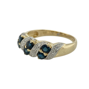 Add a touch of graceful sparkle and deep colour to your collection with this pre-owned 9ct yellow and white gold diamond and sapphire set twist band ring, blending classic elegance with a modern, flowing design, featuring:

Design: A stylish twist band design with alternating yellow and white gold tones, set with a row of deep blue sapphires and delicate diamond accents for a refined and elegant look.
Material: Made from 9-carat yellow and white gold