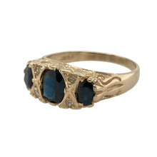 Load image into Gallery viewer, Capture the charm of a bygone era with this pre-owned 9ct yellow gold diamond and sapphire set vintage style ring, blending timeless elegance with rich colour and intricate detail, featuring:

Design: A vintage-inspired setting centred around a striking oval sapphire, framed by delicate diamond accents and detailed metalwork for a look full of classic sophistication.
Material: Made from 9-carat yellow gold, the polished finish enhances the warm tone of the setting and adds to the antique-style allure.
