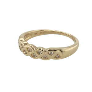 Celebrate heritage and elegance with this pre-owned 9ct yellow gold diamond set criss-cross style Celtic patterned band ring, blending symbolic design with refined sparkle, featuring:

Design: A beautifully detailed criss-cross style band with an intricate Celtic pattern, symbolising eternity and unity, enhanced with shimmering diamonds set along the flowing design.
Material: Made from 9-carat yellow gold, the polished finish brings warmth and richness