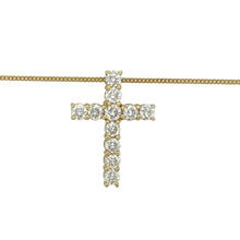 Load image into Gallery viewer, Add a meaningful touch of brilliance to your collection with this pre-owned 18ct yellow gold diamond set cross pendant necklace, combining timeless symbolism with luxurious sparkle, featuring:

Design: A classic cross pendant adorned with diamonds for a radiant finish, suspended from an 18-inch fine curb chain that complements the elegance of the design.
Material: Made from 18-carat yellow gold, the polished finish offers a rich and warm backdrop that enhances the sparkle of the diamonds.
