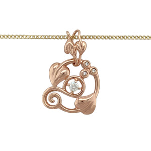 Celebrate nature, heritage, and elegance with this pre-owned 9ct yellow and rose gold diamond set Clogau Tree of Life pendant necklace, blending timeless symbolism with a touch of sparkle, featuring:

Design: The iconic Tree of Life motif is brought to life in a flowing design of leaves and vines, delicately accented with diamonds to represent growth, strength, and continuity.
Material: Crafted in 9-carat yellow and rose gold, the warm two-tone finish beautifully highlights the intricate detailing