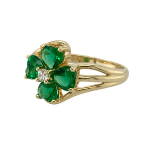 Add a pop of colour and floral charm to your jewellery collection with this pre-owned 9ct yellow gold green stone and cubic zirconia set flower ring, blending playful elegance with timeless sparkle, featuring:

Design: A striking flower-shaped arrangement made up of heart-shaped green stones forming the petals, accented with cubic zirconia at the centre for added brilliance and detail.
