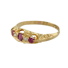 Load image into Gallery viewer, Add a touch of classic elegance to your collection with this pre-owned 18ct yellow gold diamond and ruby set vintage ring, blending rich colour with traditional design for a timeless appeal, featuring:

Design: A graceful vintage-inspired setting with a central oval-cut ruby flanked by two round rubies, accented with delicate diamonds that add refined sparkle and balance.
Material: Made from 18-carat yellow gold, the polished finish enhances the deep red tones of the rubies and the subtle brilliance

