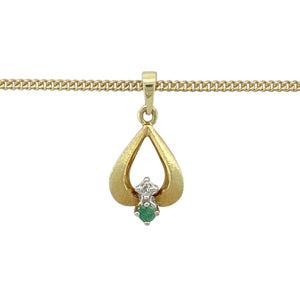 Add a touch of classic charm and vibrant colour to your collection with this pre-owned 9ct yellow gold diamond and emerald set pendant necklace, perfect for adding subtle elegance and sophistication to any look:

Design: A timeless drop-style pendant featuring a delicate round emerald, accented by a sparkling diamond for a graceful and refined finish.
Material: Crafted from 9-carat yellow gold, the polished setting offers a warm backdrop that beautifully enhances the rich green of the emerald