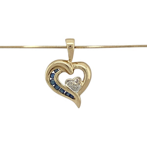 Celebrate love and elegance with this pre-owned 9ct yellow gold diamond and sapphire set open heart pendant necklace, beautifully combining classic design with symbolic charm:

Design: This graceful open heart pendant features a larger yellow gold heart accented with seven deep blue sapphires along one side, cradling a smaller white gold heart at its centre. The inner heart is set with three sparkling diamonds, adding contrast and refined brilliance.